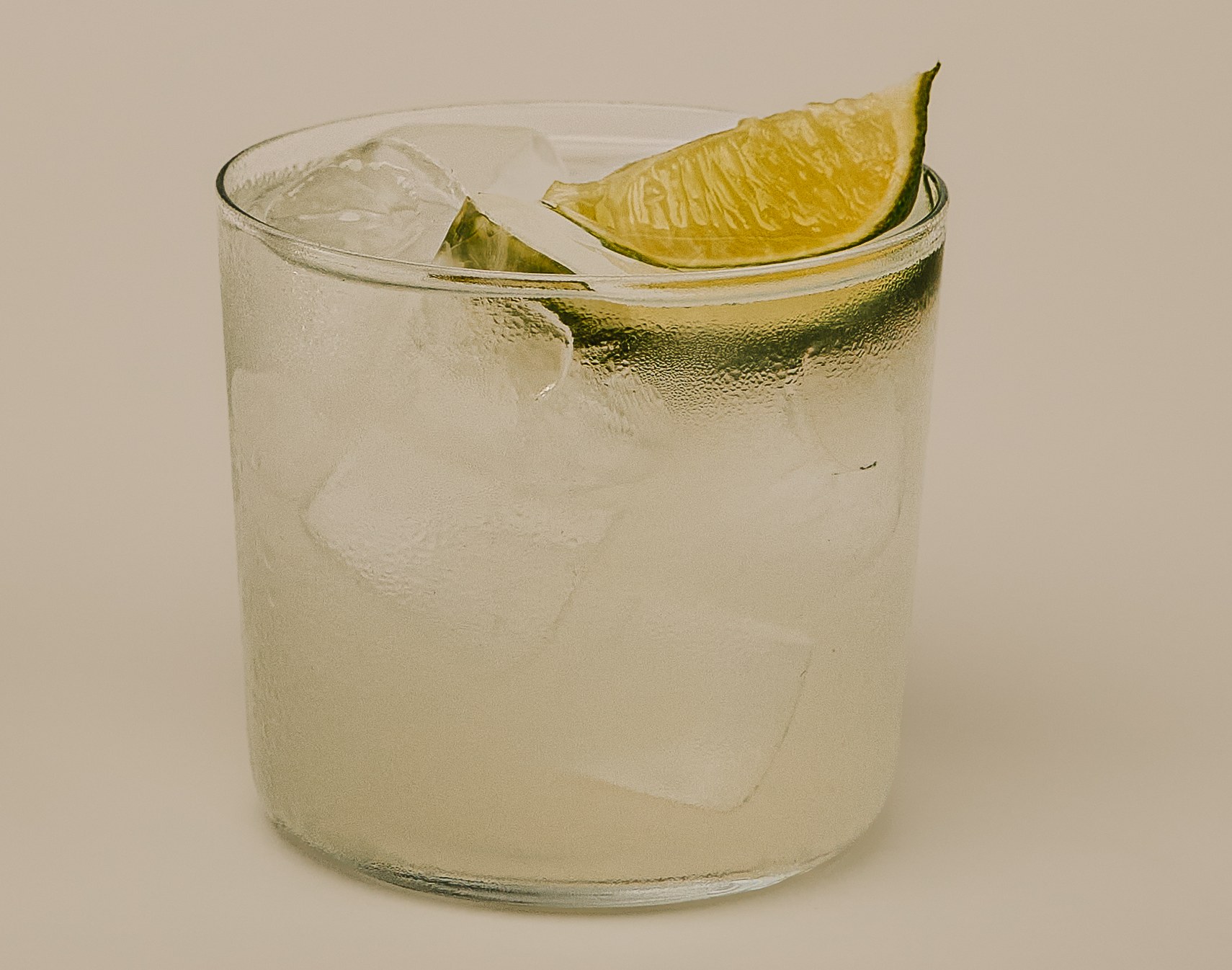 Close-up of a Margarita over ice with a lime wedge